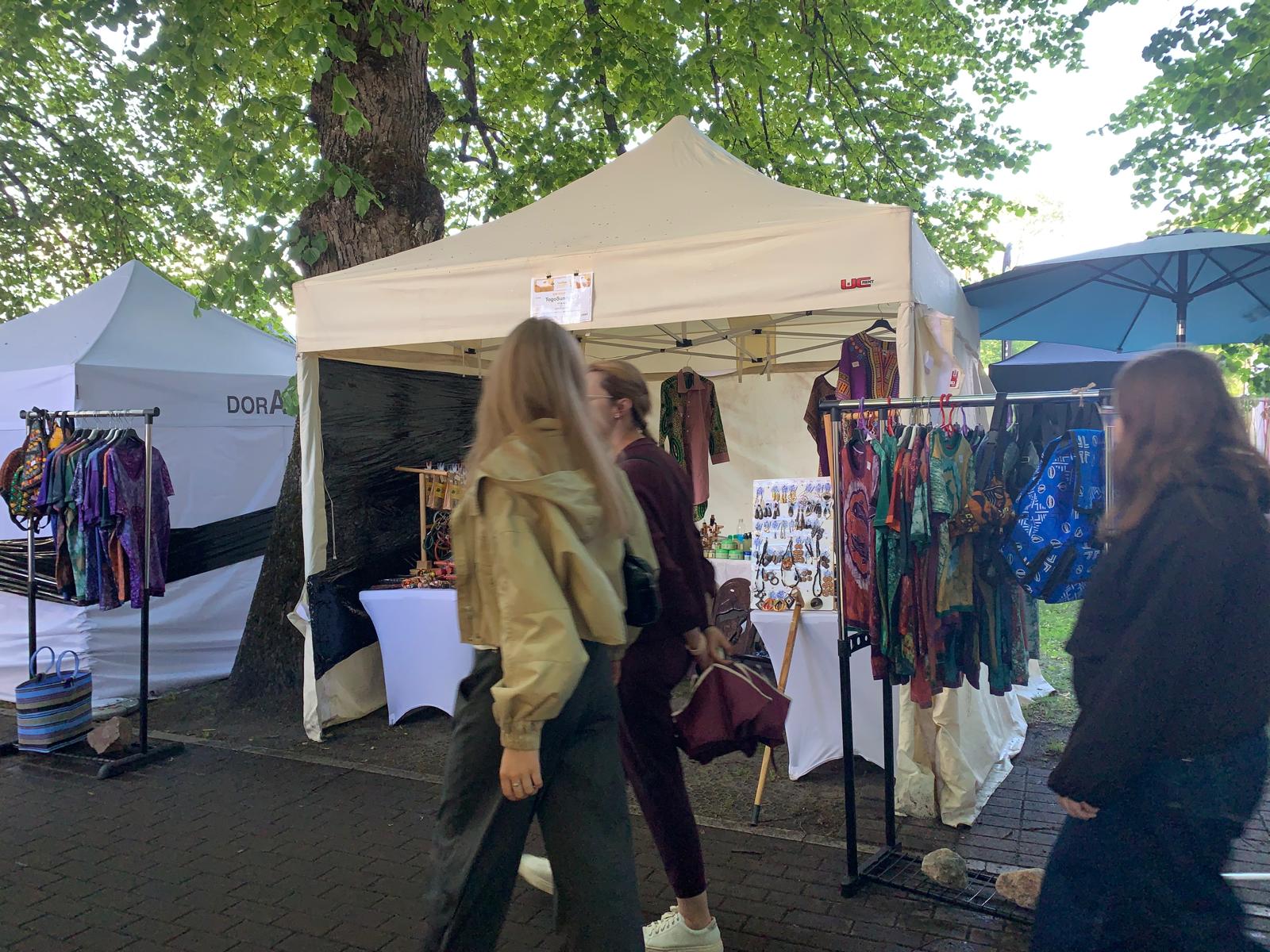 Visitors passing by the TogoSunny stand at Pärnu Hansapäevad