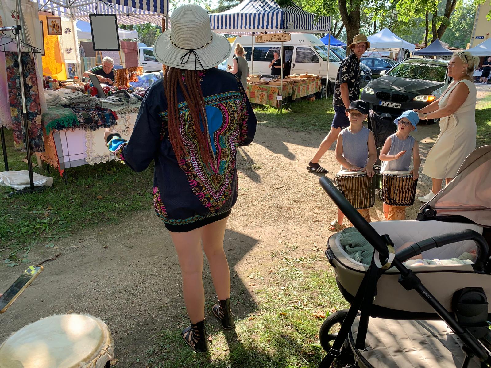 Kids playing djembe at Hauka Fair