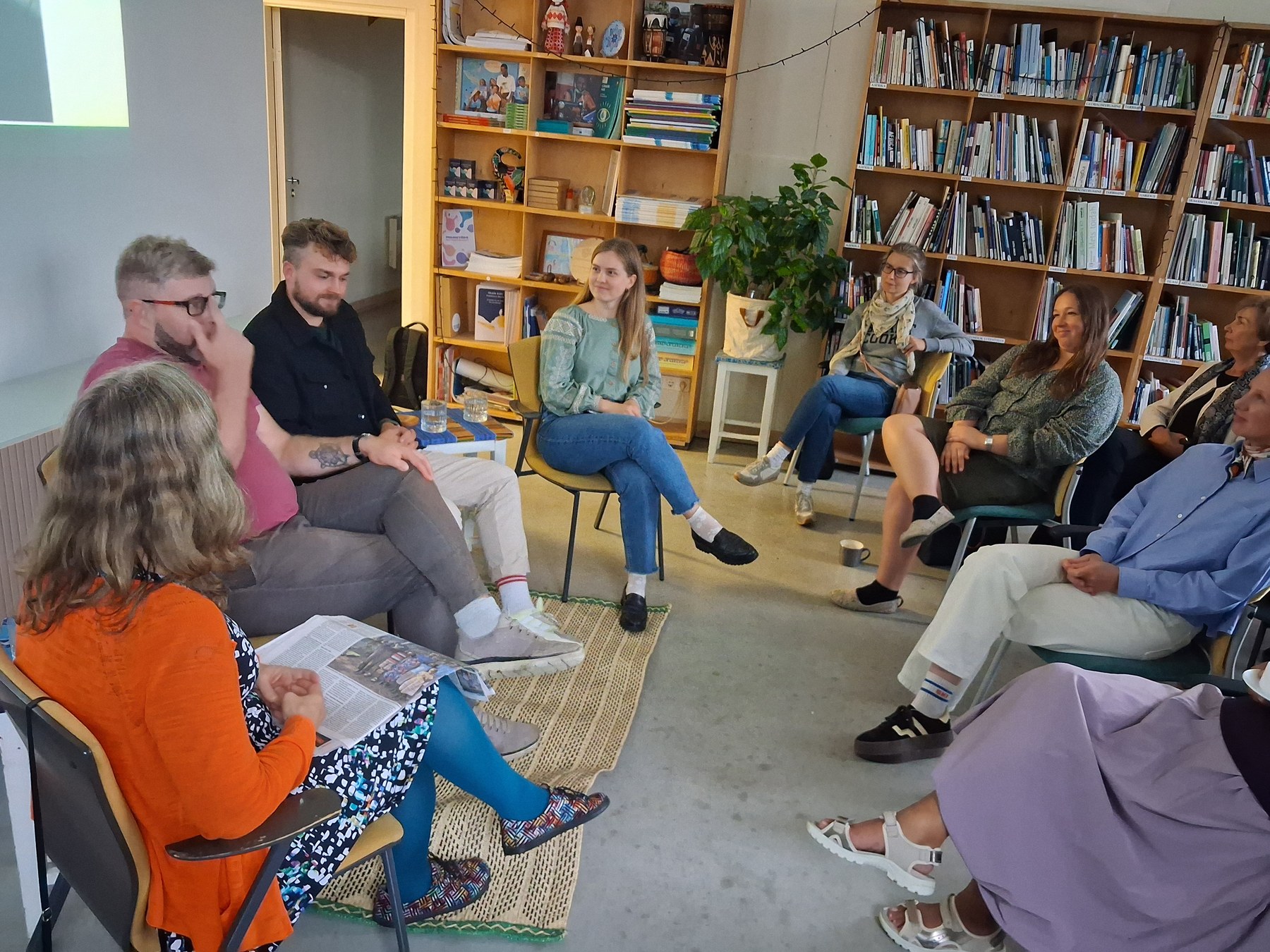 Guests seated in a circle around the storytellers