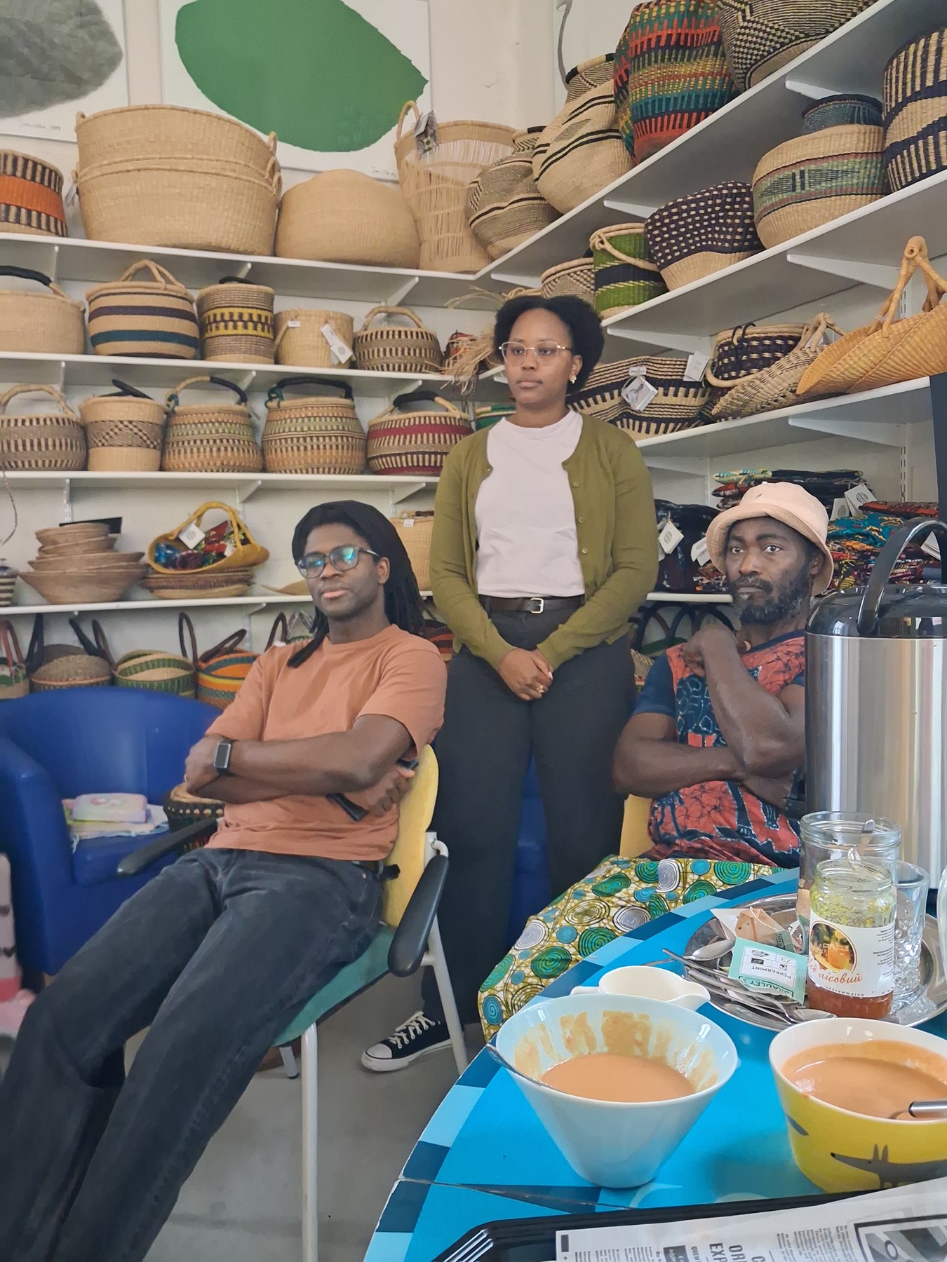 TogoSunny team standing among baskets and textiles